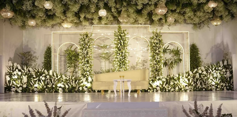 Airy white and green stage with framed floral panels