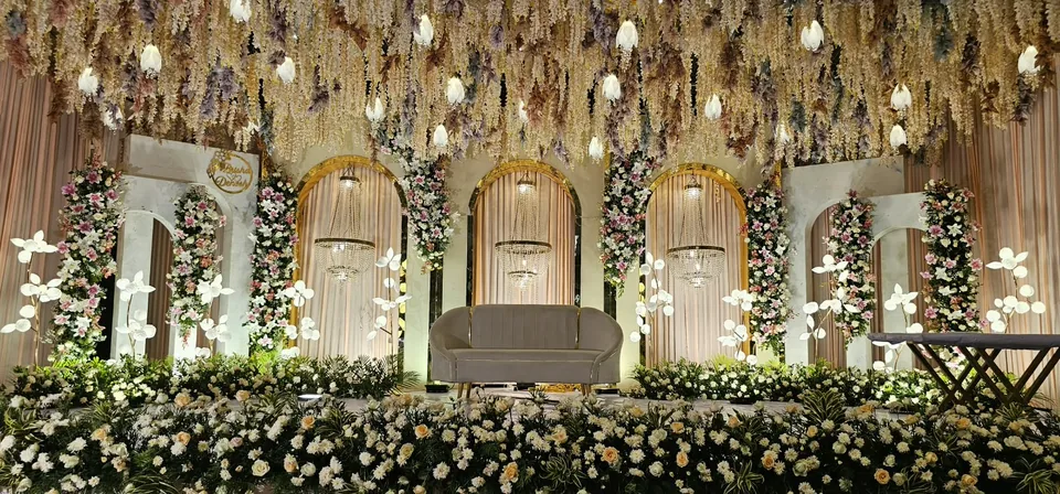 Fresh green and white stage with styled bench seating